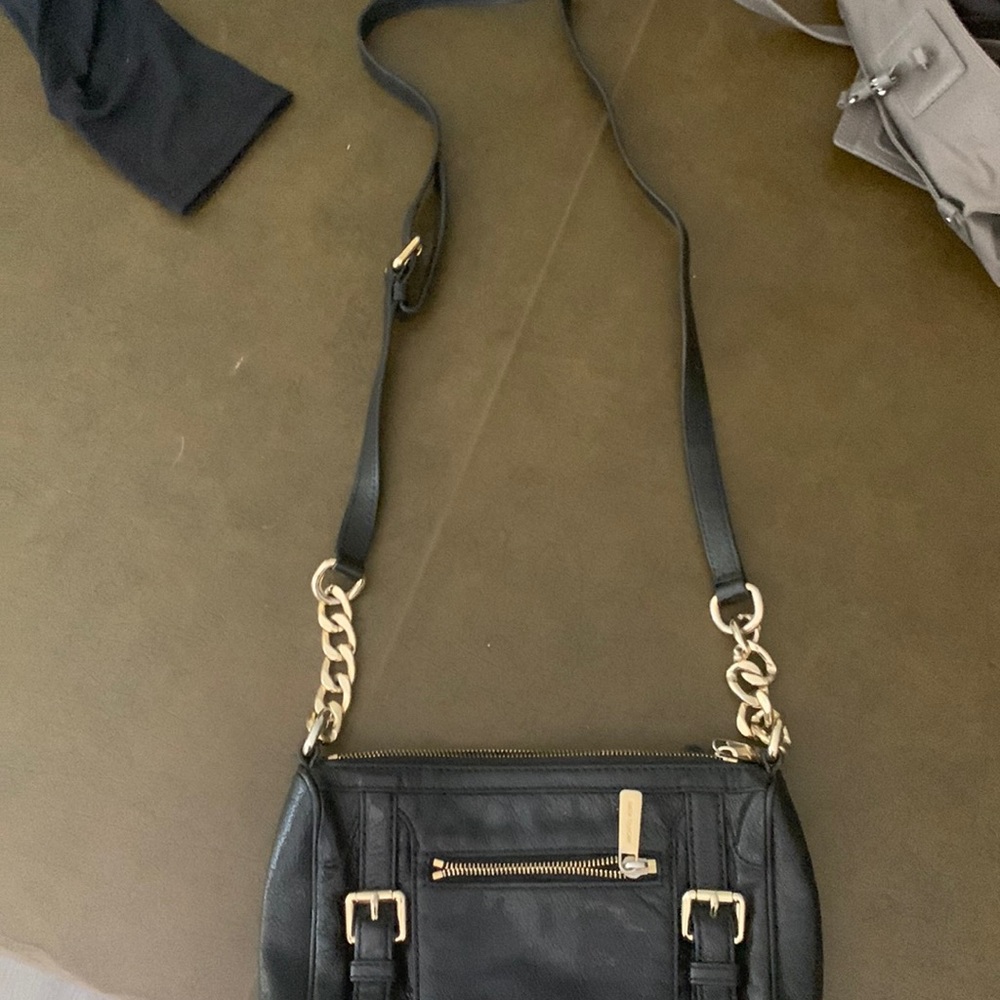 A black Michael Kors chain purse